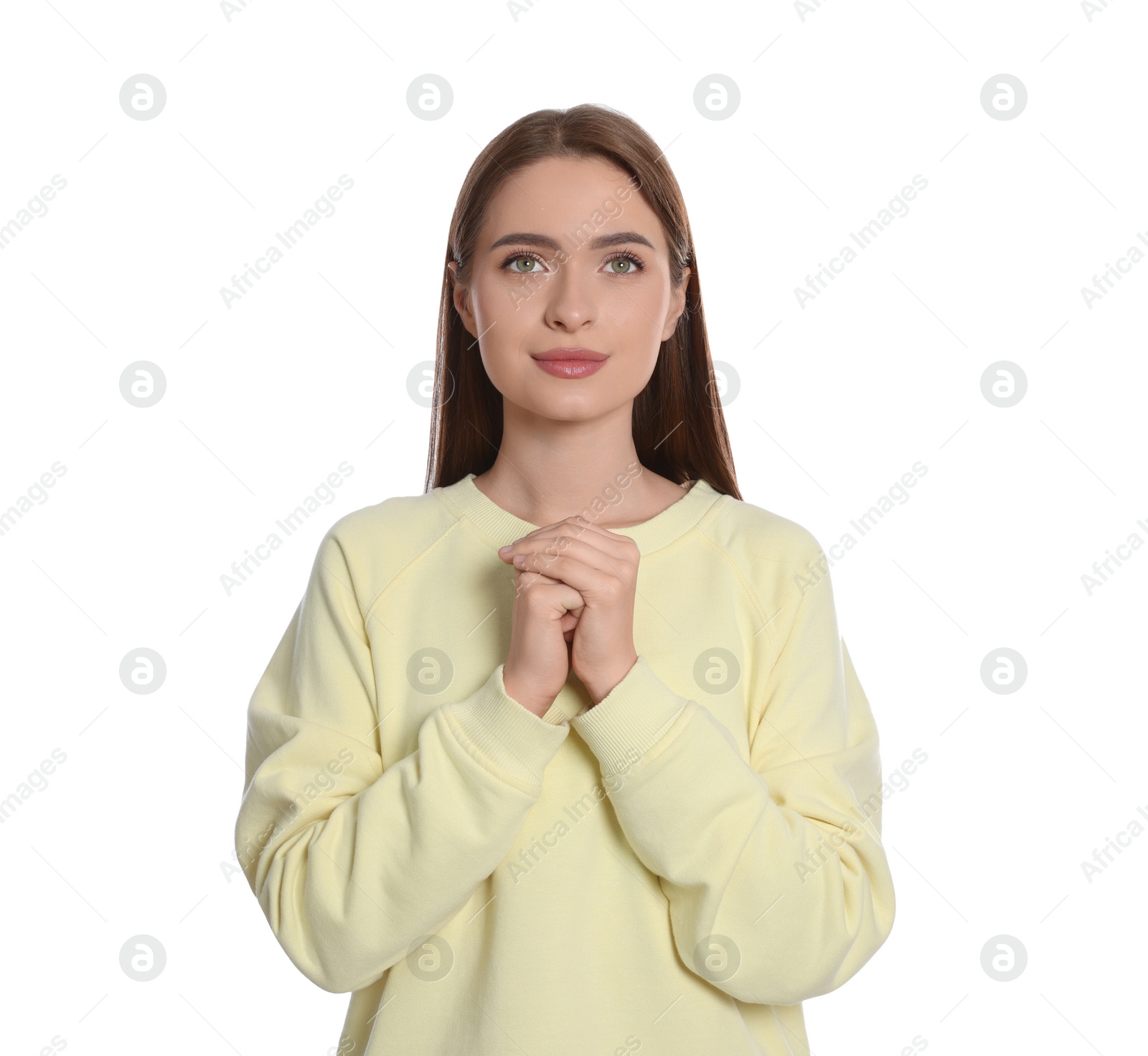 Photo of Woman with clasped hands praying on white background