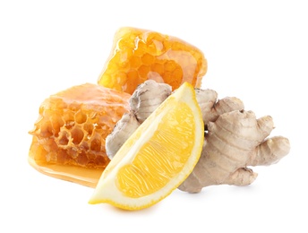 Image of Cut lemon, ginger root and honeycombs on white background