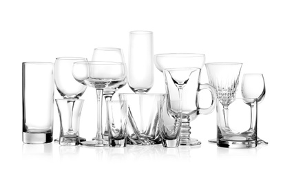 Set of new bar glassware on white background