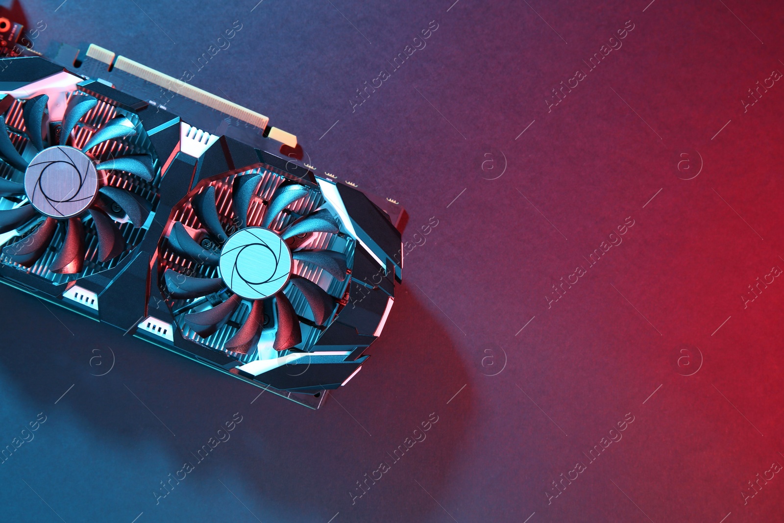 Photo of Computer graphics card on color background, top view. Space for text