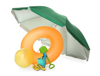 Photo of Beach umbrella, inflatable ring, ball and child's sand toys on white background