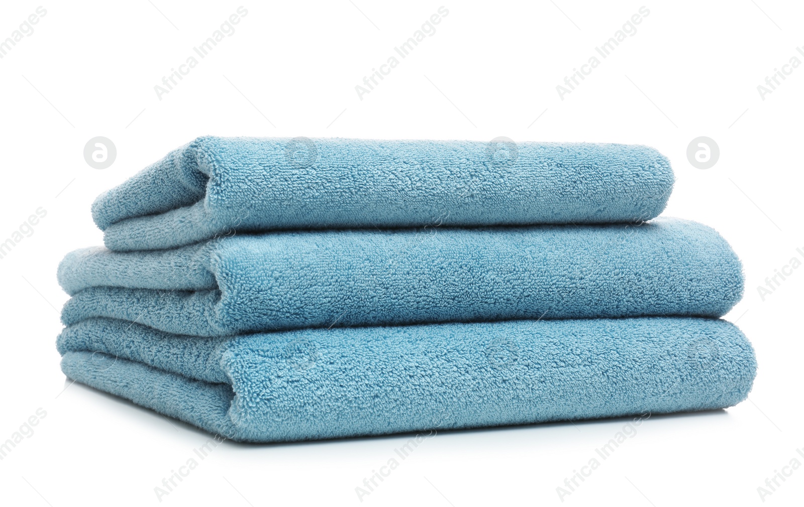 Photo of Stack of clean folded towels on white background