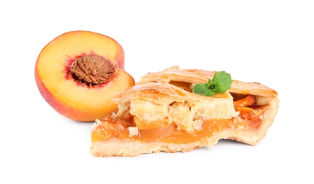 Photo of Slice of delicious peach pie and fresh fruit isolated on white