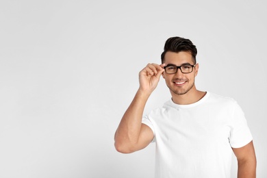 Photo of Portrait of handsome young man and space for text on white background