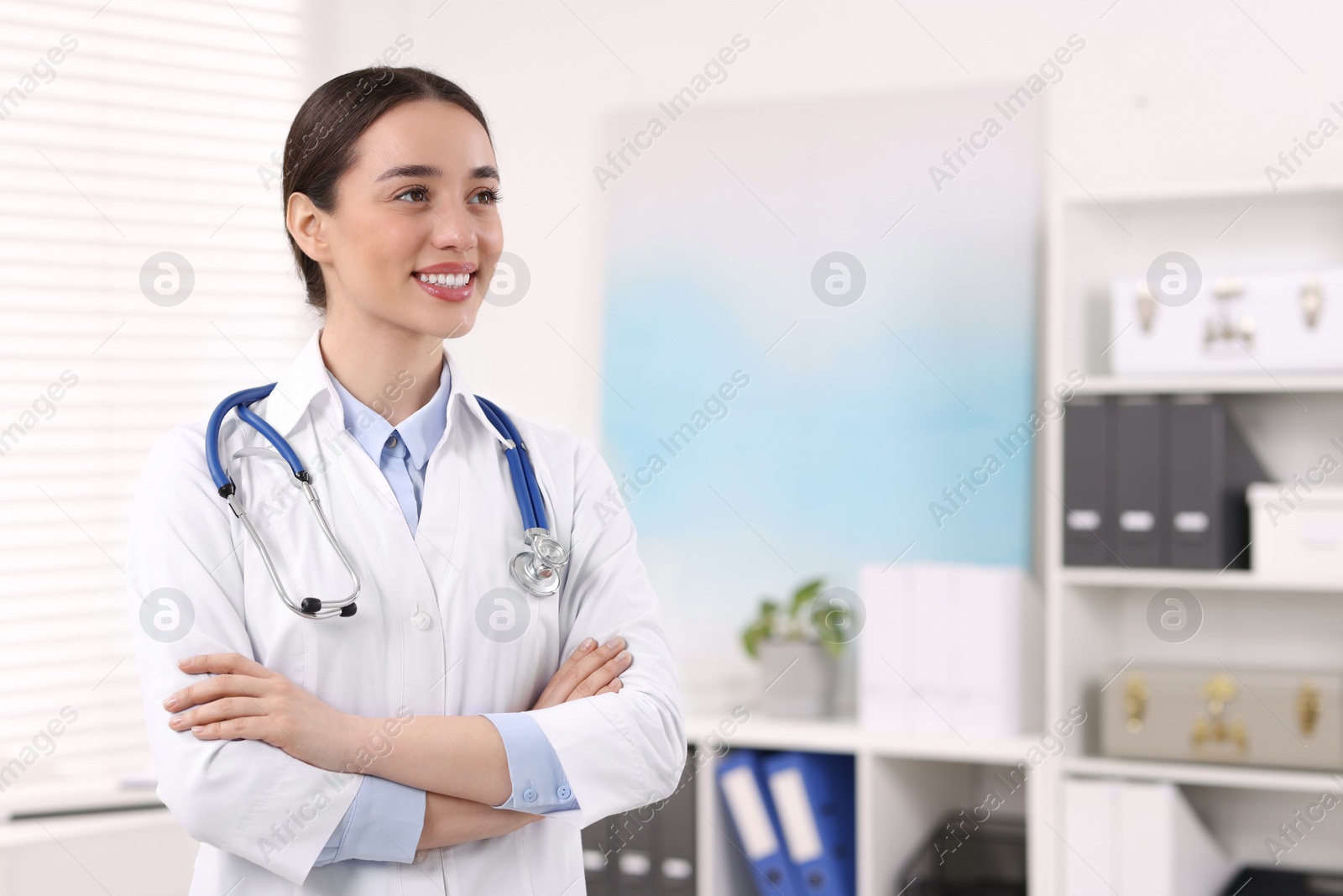 Photo of Medical consultant with stethoscope in clinic, space for text