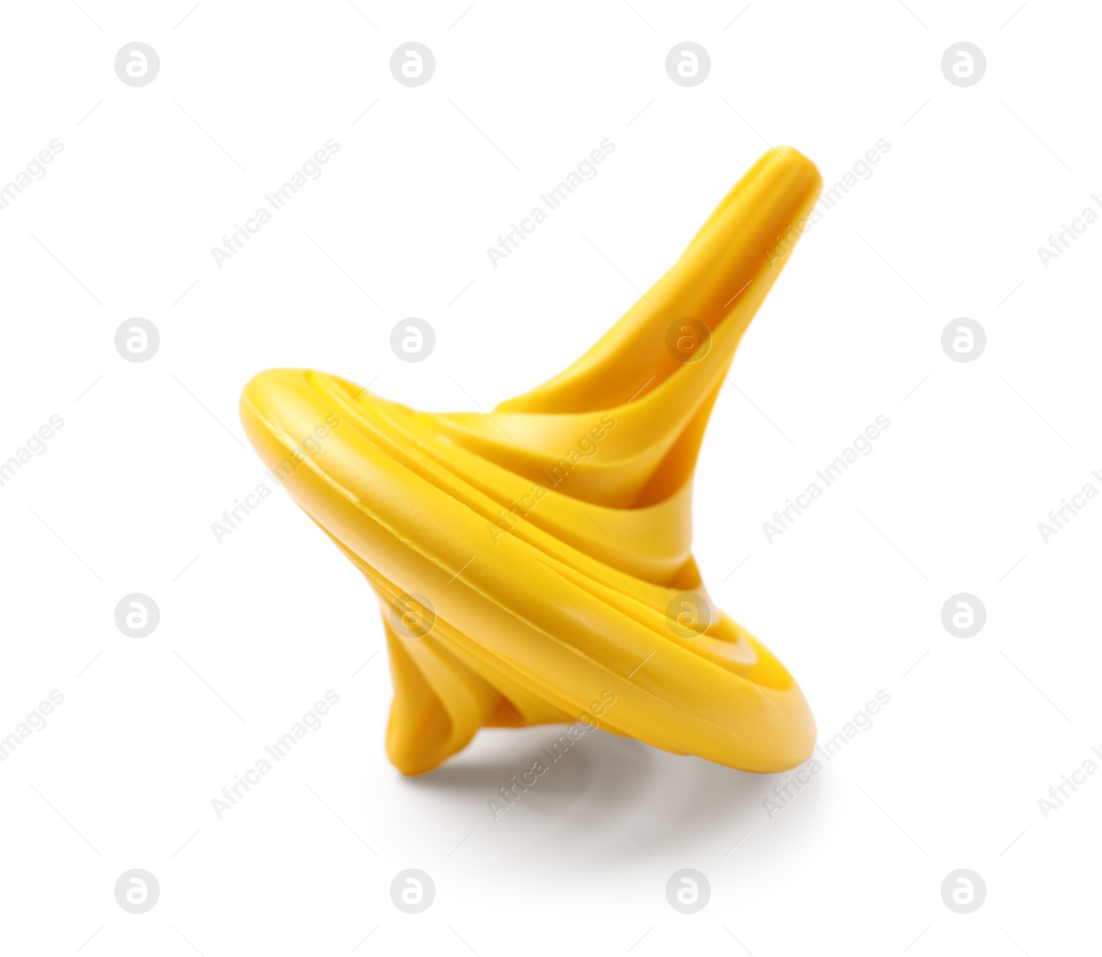 Photo of One yellow spinning top on white background