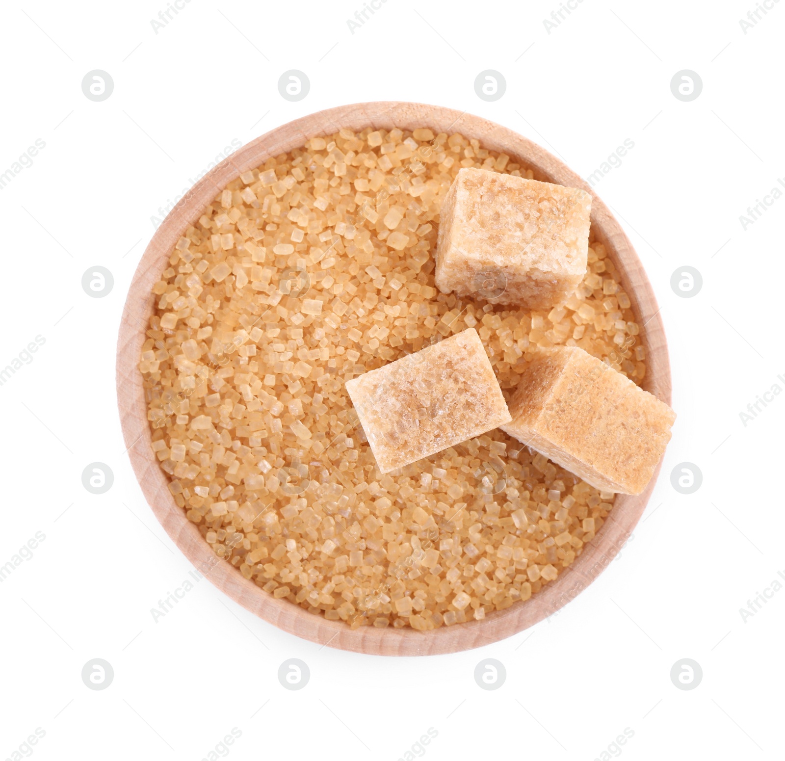 Photo of Different types of brown sugar in bowl isolated on white, top view