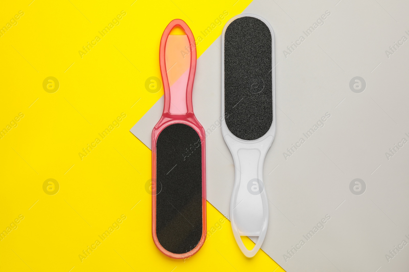 Photo of Foot files on color background, flat lay. Pedicure tools