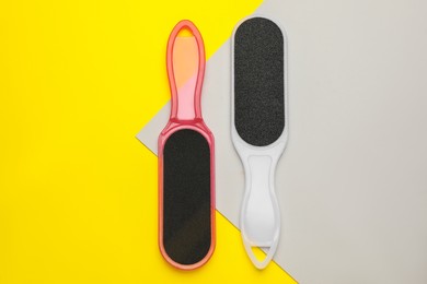 Foot files on color background, flat lay. Pedicure tools