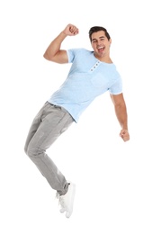 Photo of Handsome young man dancing on white background