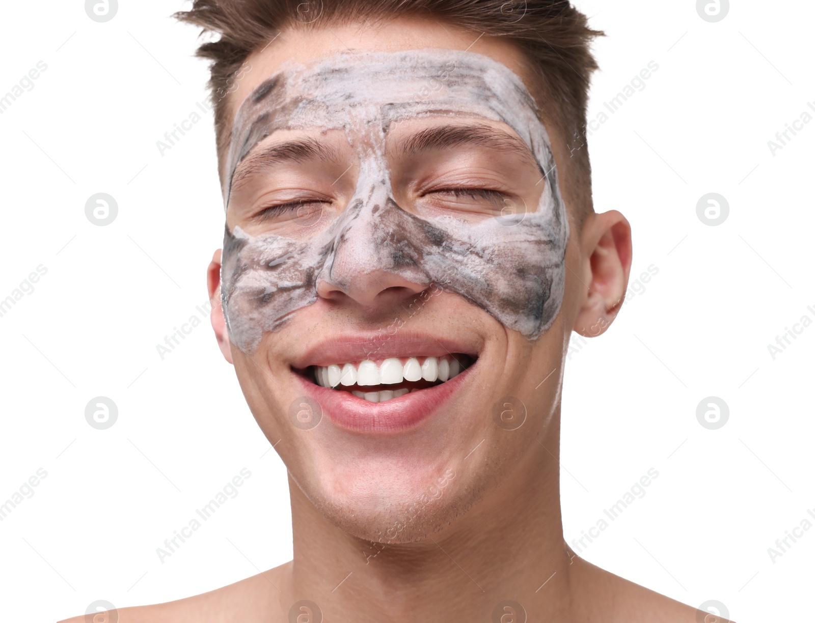 Photo of Handsome man with clay mask on his face against white background
