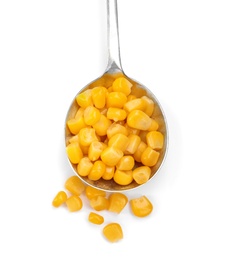 Spoon with corn kernels on white background, top view