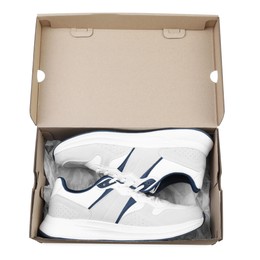 Photo of Pair of stylish sport shoes in cardboard box on white background, top view