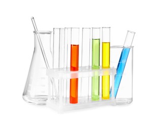 Photo of Glass flask, beaker and test tubes with colorful liquids isolated on white