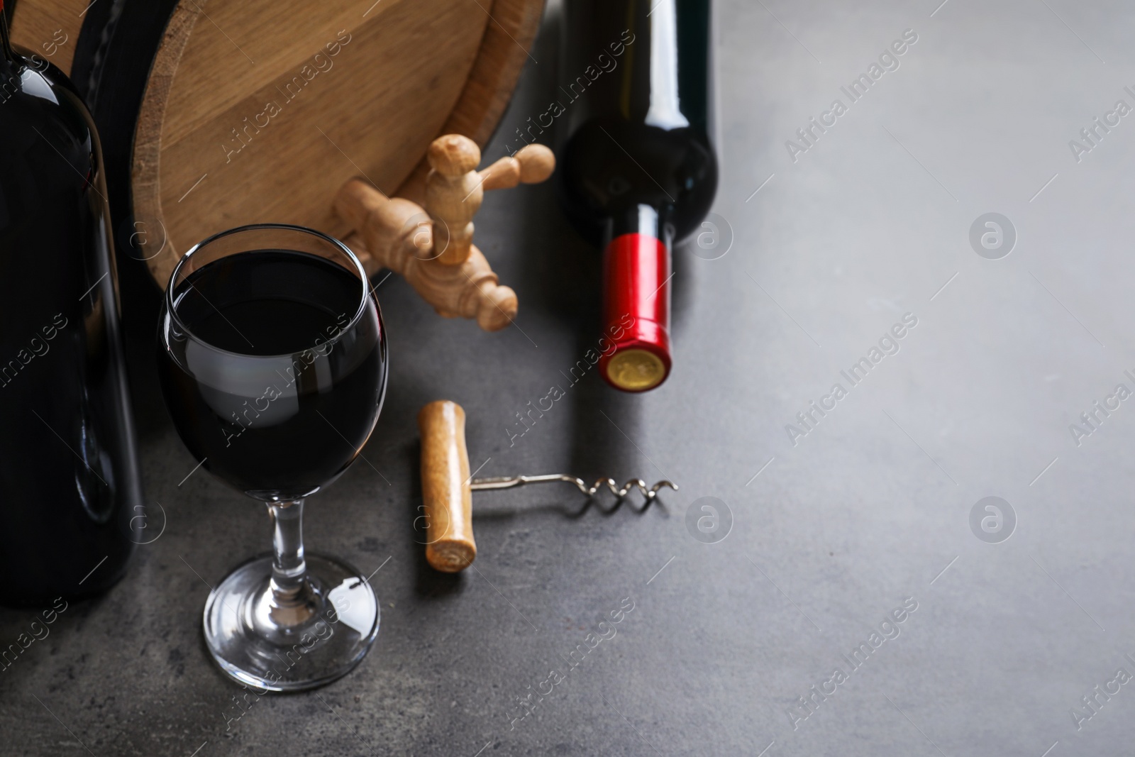 Photo of Composition with delicious red wine on grey background