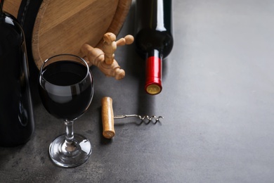 Photo of Composition with delicious red wine on grey background