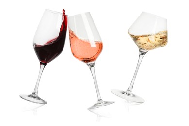 Image of Different types of wine splashing in glasses on white background