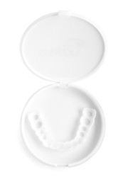 Dental mouth guard in container on white background, top view. Bite correction