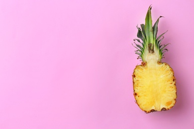 Photo of Fresh pineapple half on color background