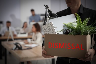 Image of Dismissed man carrying box with stuff in office, closeup