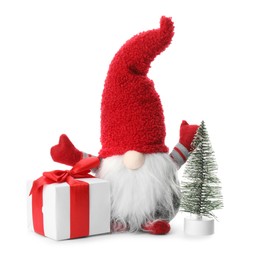 Funny Christmas gnome with tree and gift box on white background