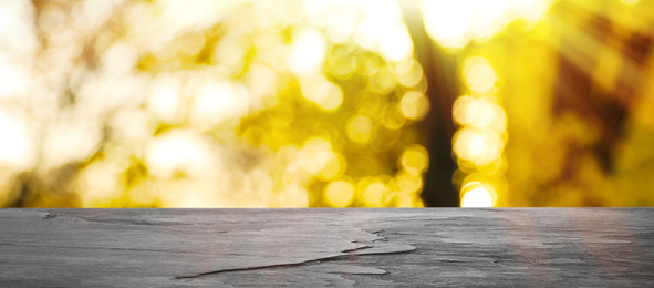 Empty wooden surface against blurred background. Bokeh effect