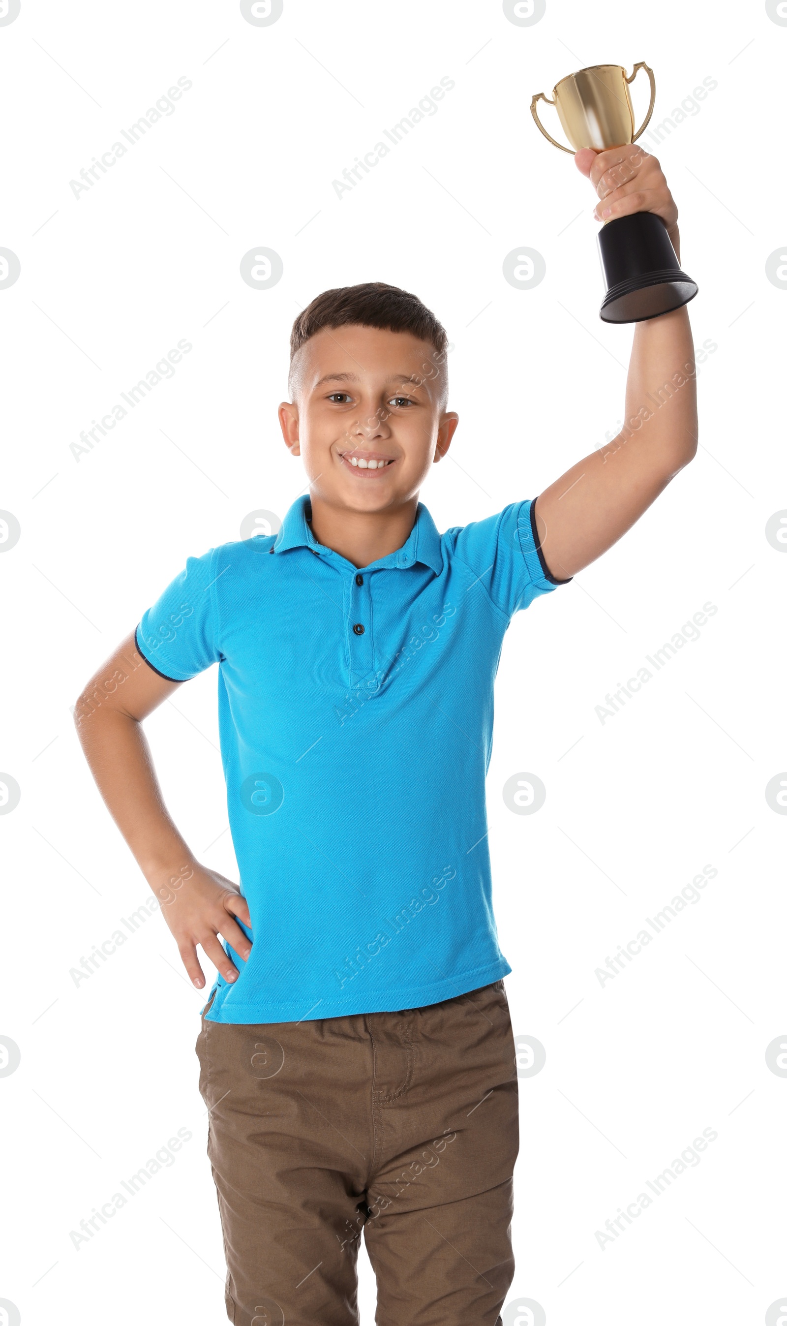 Photo of Happy boy with golden winning cup on white background