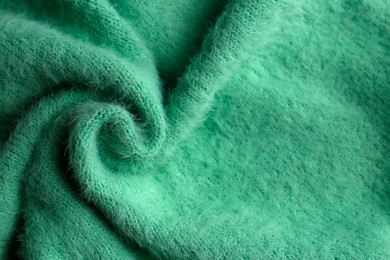 Photo of Beautiful green fabric as background, top view