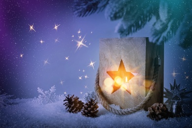 Image of Composition with wooden Christmas lantern on snow, space for text. Magical atmosphere 