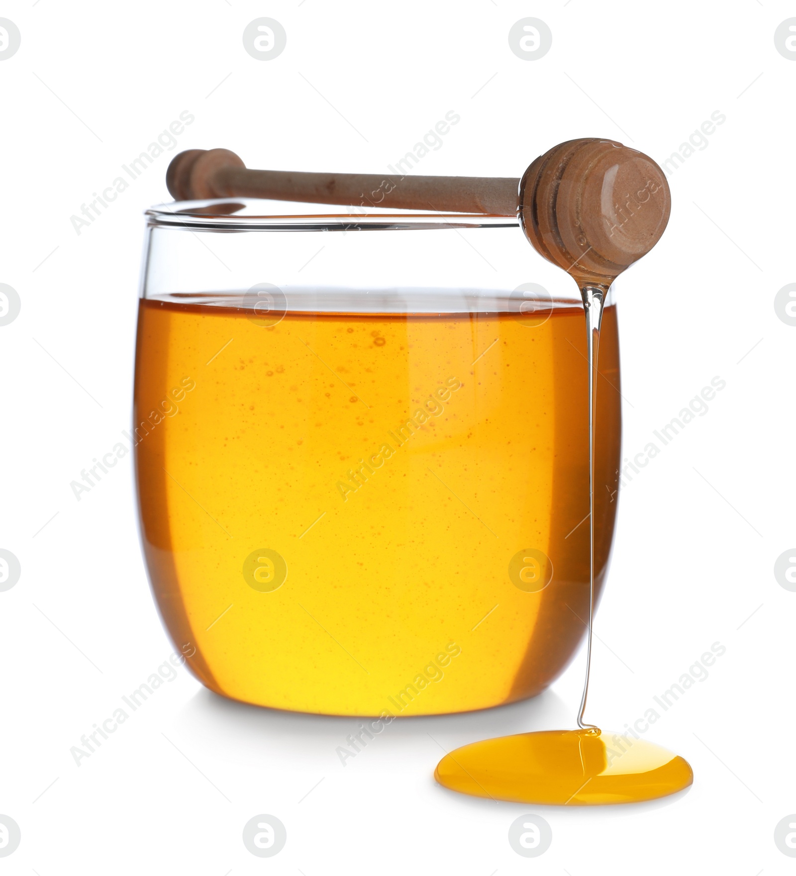 Photo of Jar of organic honey and dipper isolated on white