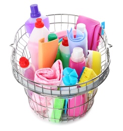 Metal shopping basket with different household chemicals on white background