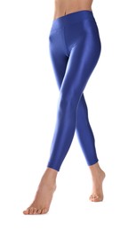 Woman with beautiful long legs wearing blue leggings on white background, closeup