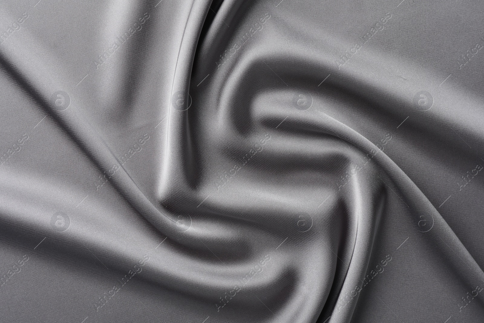 Photo of Texture of beautiful light grey silk fabric as background, closeup