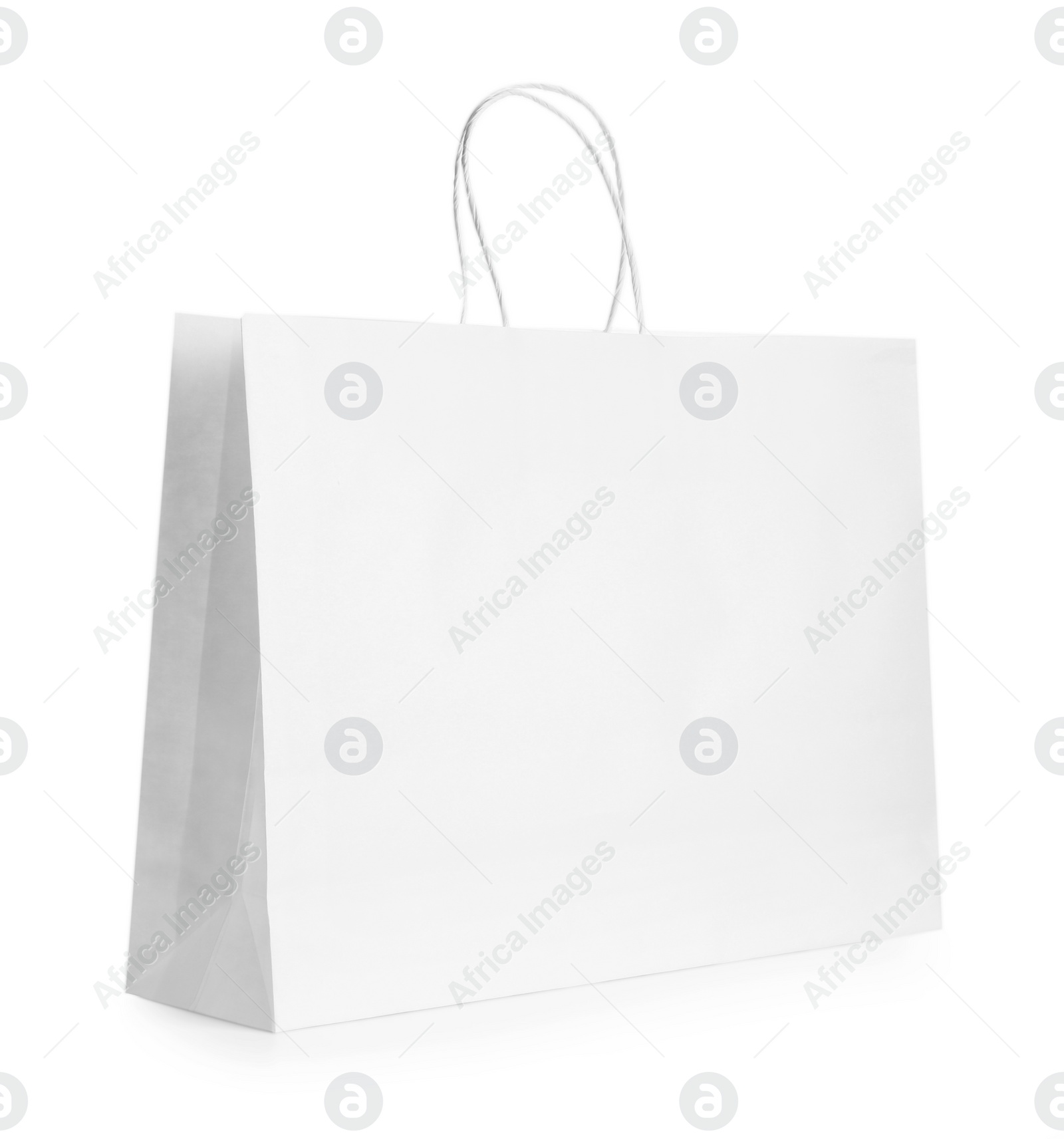 Photo of One paper bag isolated on white. Mockup for design