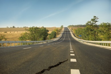 Large crack on asphalt road after earthquake