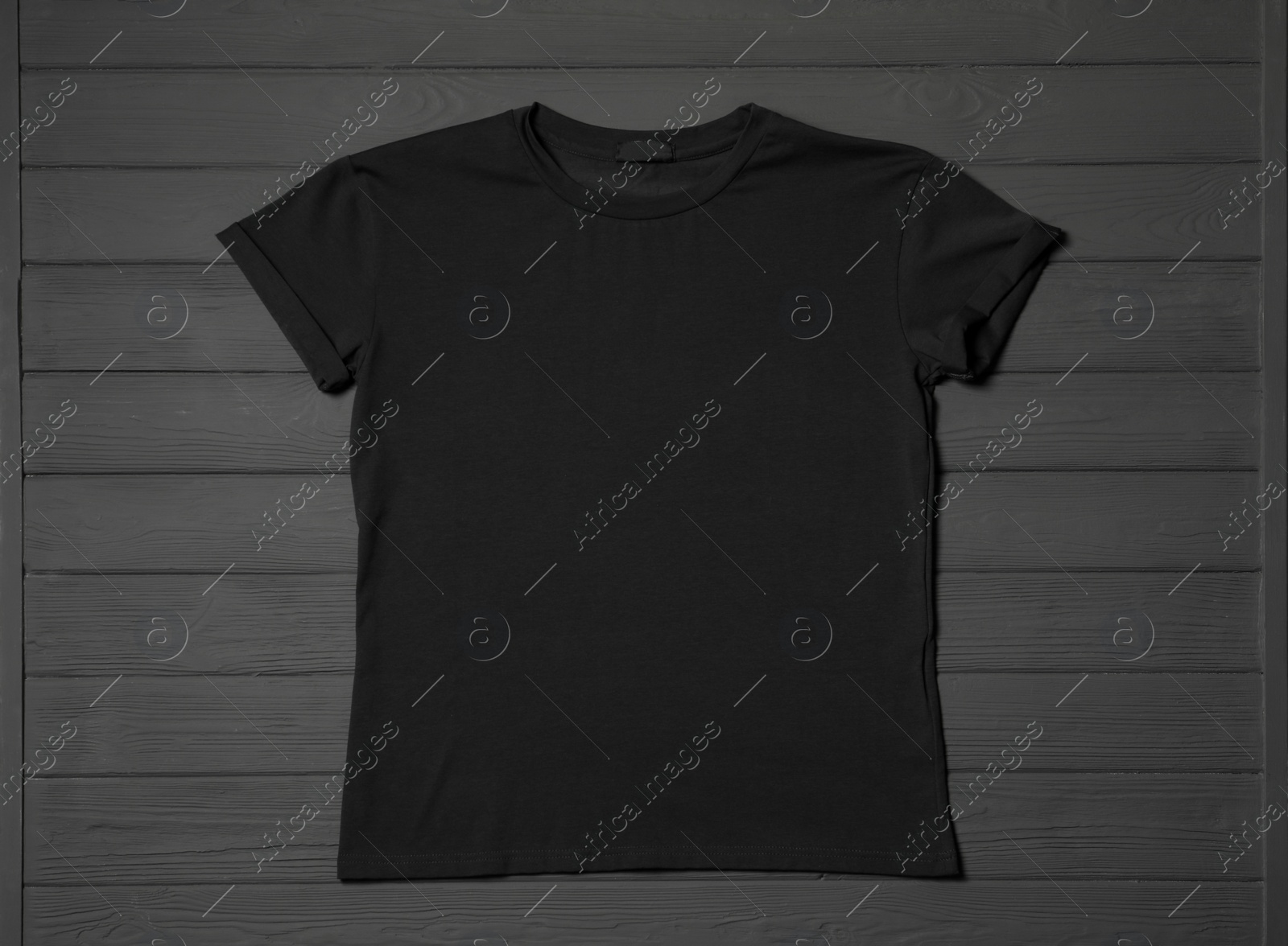 Photo of Stylish black T-shirt on gray wooden table, top view