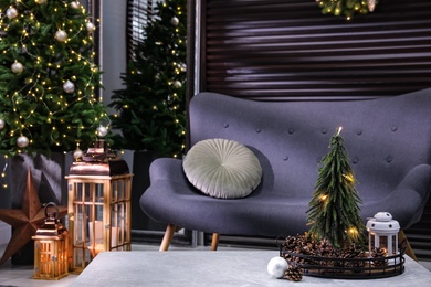 Photo of Elegant living room interior with comfortable sofa and Christmas decor