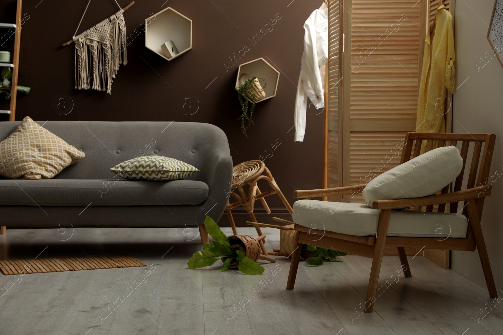 Photo of View on messy living room interior after earthquake