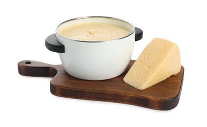 Fondue with tasty melted cheese and piece isolated on white