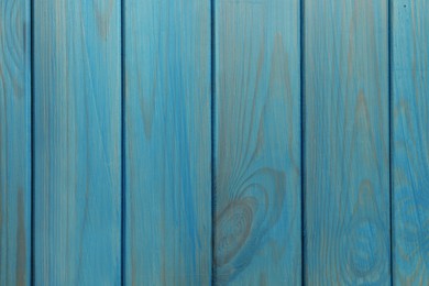 Photo of Texture of light blue wooden surface as background, top view