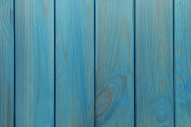 Texture of light blue wooden surface as background, top view