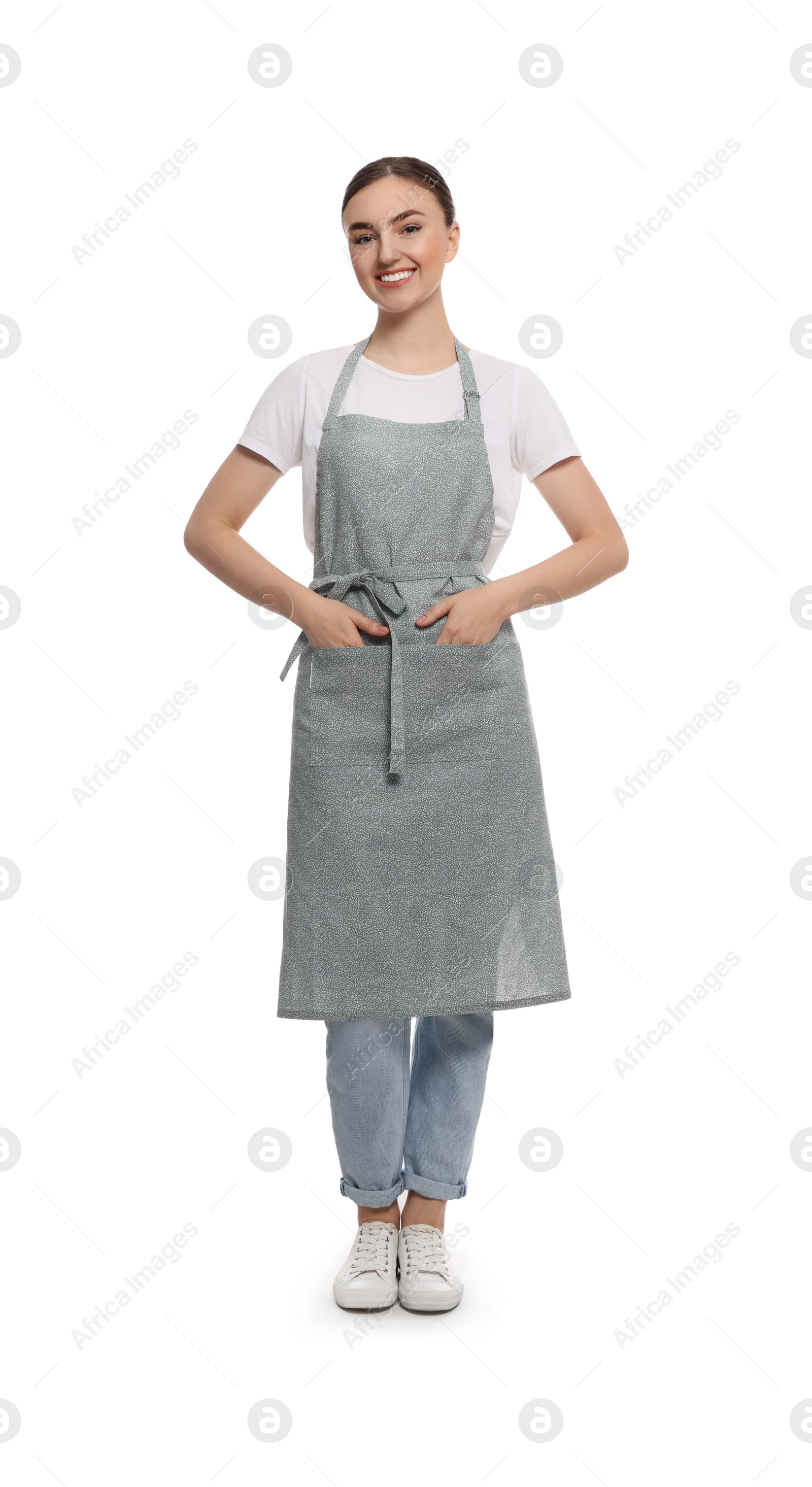 Photo of Beautiful young woman in clean apron on white background