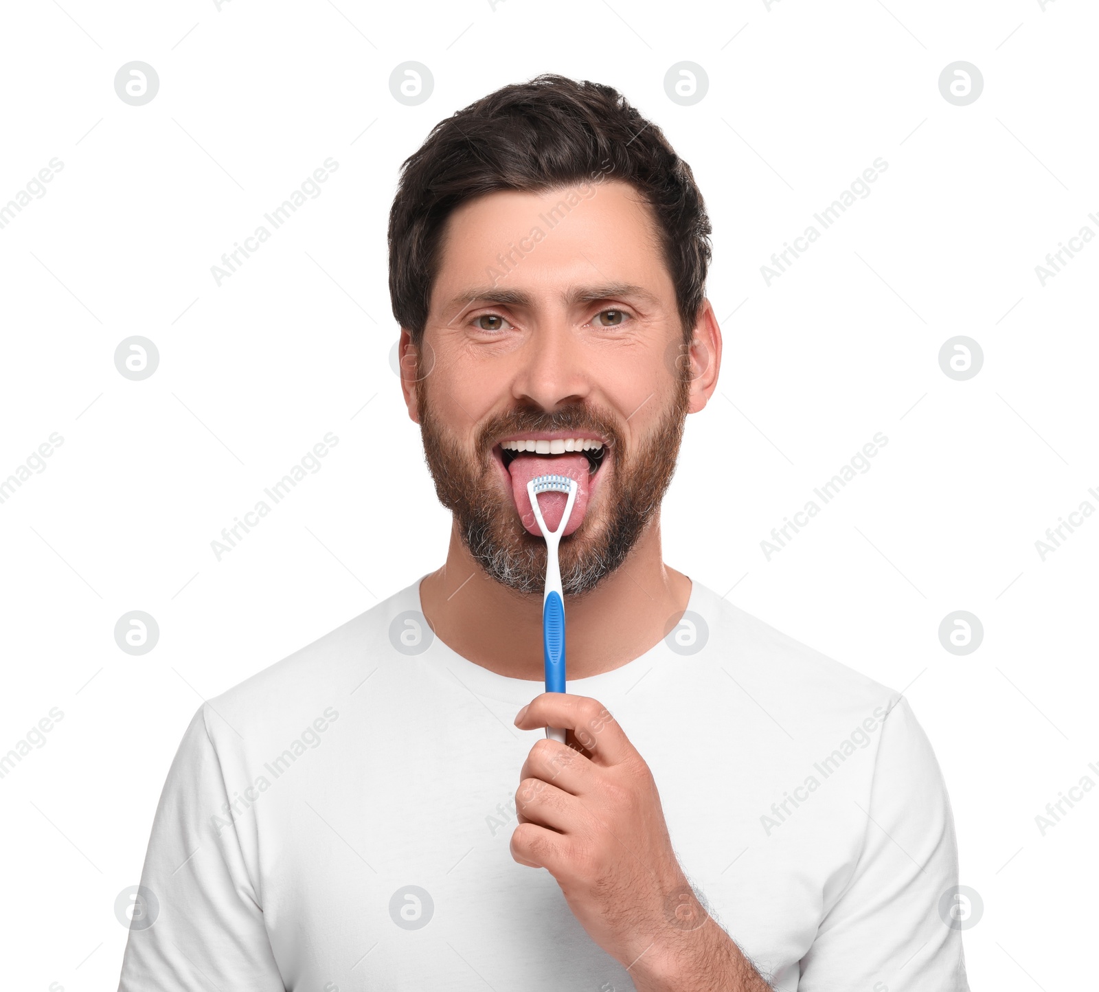 Photo of Happy man brushing his tongue with cleaner on white background