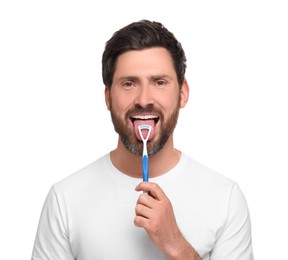 Photo of Happy man brushing his tongue with cleaner on white background