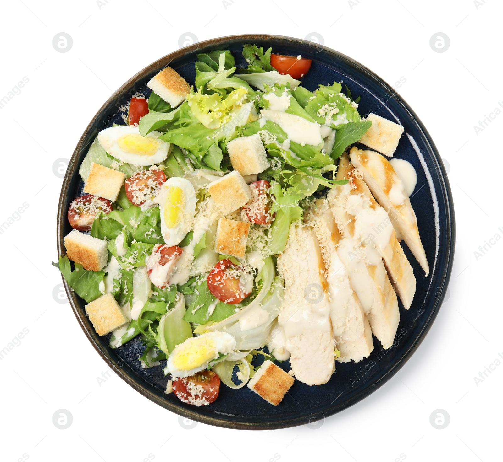 Photo of Delicious Caesar salad in bowl isolated on white, top view