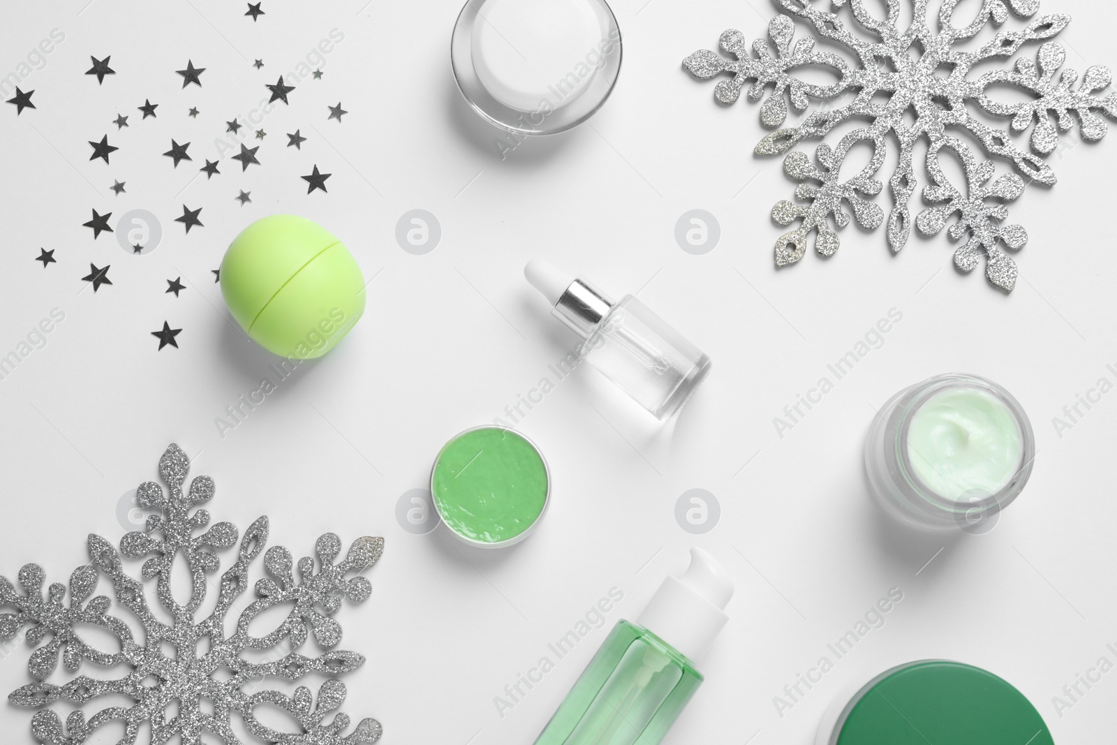 Photo of Set of cosmetic products on white background, flat lay. Winter care