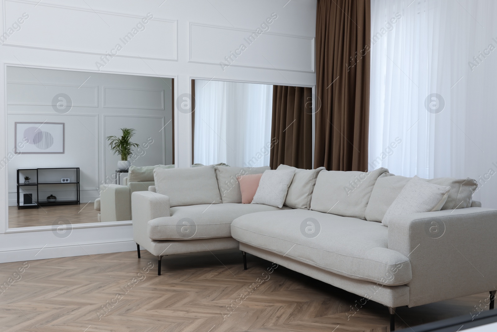 Photo of Modern living room with parquet flooring and stylish furniture