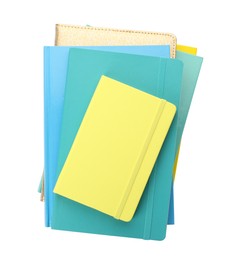 Photo of Stack of different colorful hardcover planners on white background, top view