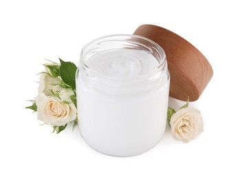 Jar of hand cream and roses on white background