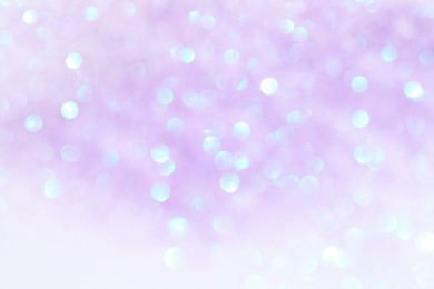 Shiny lilac background with magical bokeh effect